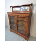 A 19th century walnut inlaid chiffonier with raised mirrored back and ormolu mounts est: £300-£500