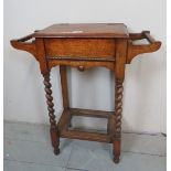 An early 20th century oak hall stand of small proportions, with lift up compartment to top,