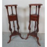 A pair of decorative 20th century mahogany jardiniere stands with two small drawers to each,