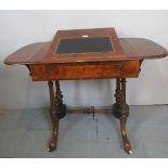 A fine Victorian figured walnut writing table with rising slope to top over a drawer and ornate