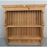 A 20th century pine wall mounting tiered plate rack,