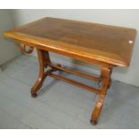 A late 19th century walnut and oak occasional table with decorative bentwood and turned end