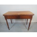 A 19th century mahogany turn over tea table,