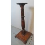 A decorative carved mahogany torchere stand est: £30-£50