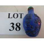 A Chinese blue glass snuff bottle with hard-stone stopper,