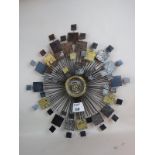 A stylish piece of contemporary wall art, abstract sunburst form, metal construction,