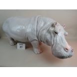 A large well modelled glazed ceramic hippo, 90 cm long,