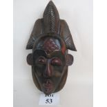 An African tribal mask, 20th century, hand carved from a single piece of wood,