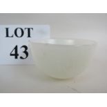 A Chinese white jade bowl, small steep sided circular form, low relief decoration,