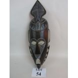 An African tribal mask, 20th century, hand carved from a single piece of wood,