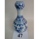 A Chinese blue and white porcelain bottle vase, garlic neck, underside with painted character marks,