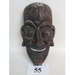 An African tribal mask, 20th century, hand carved from a single piece of wood,