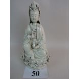 A Chinese Blanc de Chine porcelain figur