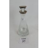 A designer silver topped and rimmed glass decanter est: £30-£50