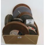 A box of assorted old film reels, tins,