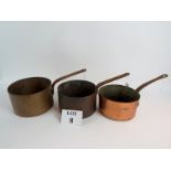 Three copper saucepans,