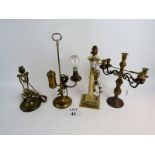 A collection of four brass light and candle holder fittings est: £50-£80