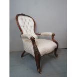 A Victorian carved mahogany framed spoon back armchair,