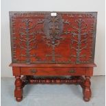 A 20th century Armada style chest, with intricate metalwork design, on a turned mahogany stand,