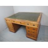 A fantastic large Victorian pale mahogany pedestal partner's desk,