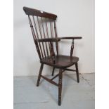 A 19th century country oak Windsor spindle back armchair, with turned supports and legs, 43.