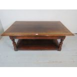 A Titchmarsh & Goodwin period style, solid oak coffee table, with two drawers, over a lower shelf,