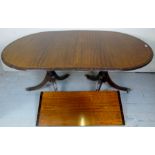 A 20th century mahogany and rosewood banded twin pedestal dining table,