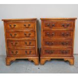 A pair of 20th century walnut bedside chests of four drawers and in clean condition est: £100-£150