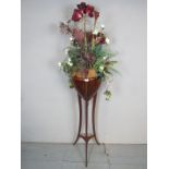 A 20th century mahogany jardiniere stand, in the Empire-style,