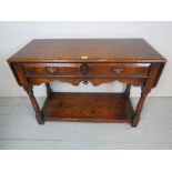 A Titchmarsh & Goodwin period style solid oak drop leaf, serving table with two drawers,