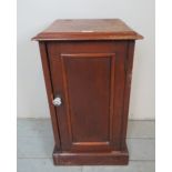 A 19th century mahogany pot cupboard, with a lift up top, over a single cabinet door,