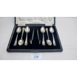 A set of six silver teaspoons and matchi