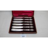A set of six silver handled tea knives,