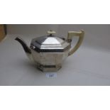 An Art Deco silver teapot with ivory han