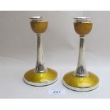 A pair of silver and yellow enamelled ca