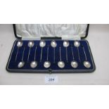 A set of twelve silver coffee spoons wit