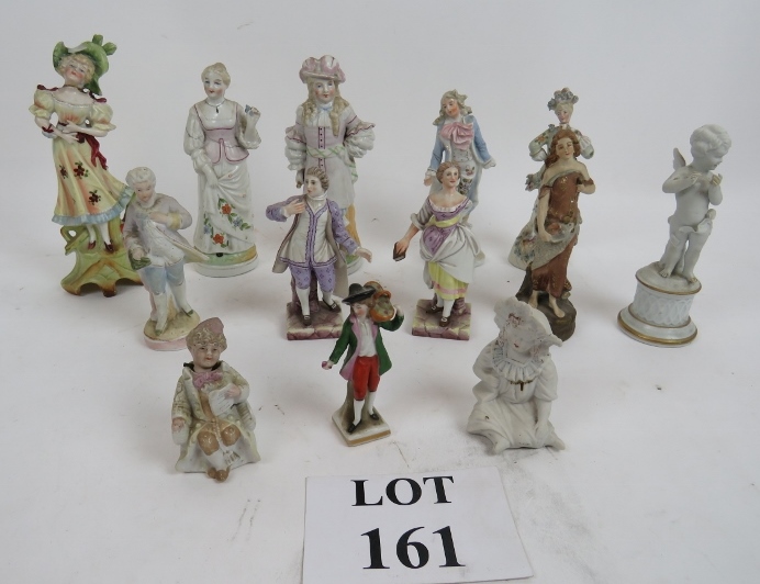 Thirteen continental figurines, some bea