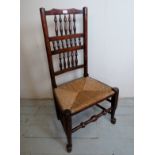 An 18th century oak country rush seated