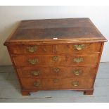 An early 18th century walnut chest of tw
