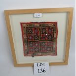 A framed oriental needlework panel, late