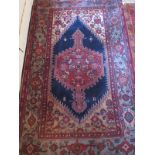 A 20th century Persian rug, with central