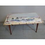 A 1960's/1970's low coffee table with a