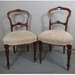 A pretty pair of Victorian carved walnut