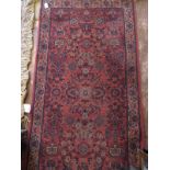 A 20th century Persian rug, with central