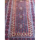 A mid 20th century Turkish rug on red/cr