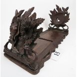 A beautifully carved oak book slide, possibly Black Forest,