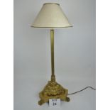 An ornate period-style gilt-metal and gilt-wood table lamp,