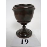 A Victorian/Edwardian turned oak pedestal cup,