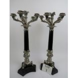 A pair of 20th century Georgian style silver plated and ebonised candelabra,