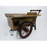 An attractive vintage model cart, hand-painted wooden construction with metal mounts,